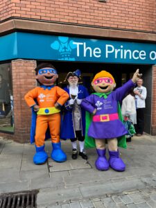 The new The Prince of Wales Hospice superstore town crier and mascots