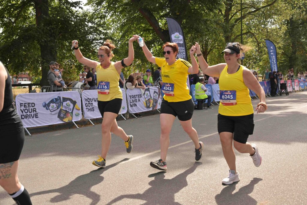 Sahar Ellis, her sister and her friend completing the York 10k in yellow tops