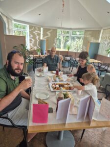 James and his family enjoy afternoon tea together in the garden room