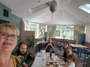 James and his family enjoy afternoon tea together in the garden room