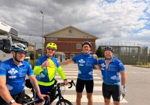 Tour de hmp cyclists posing together