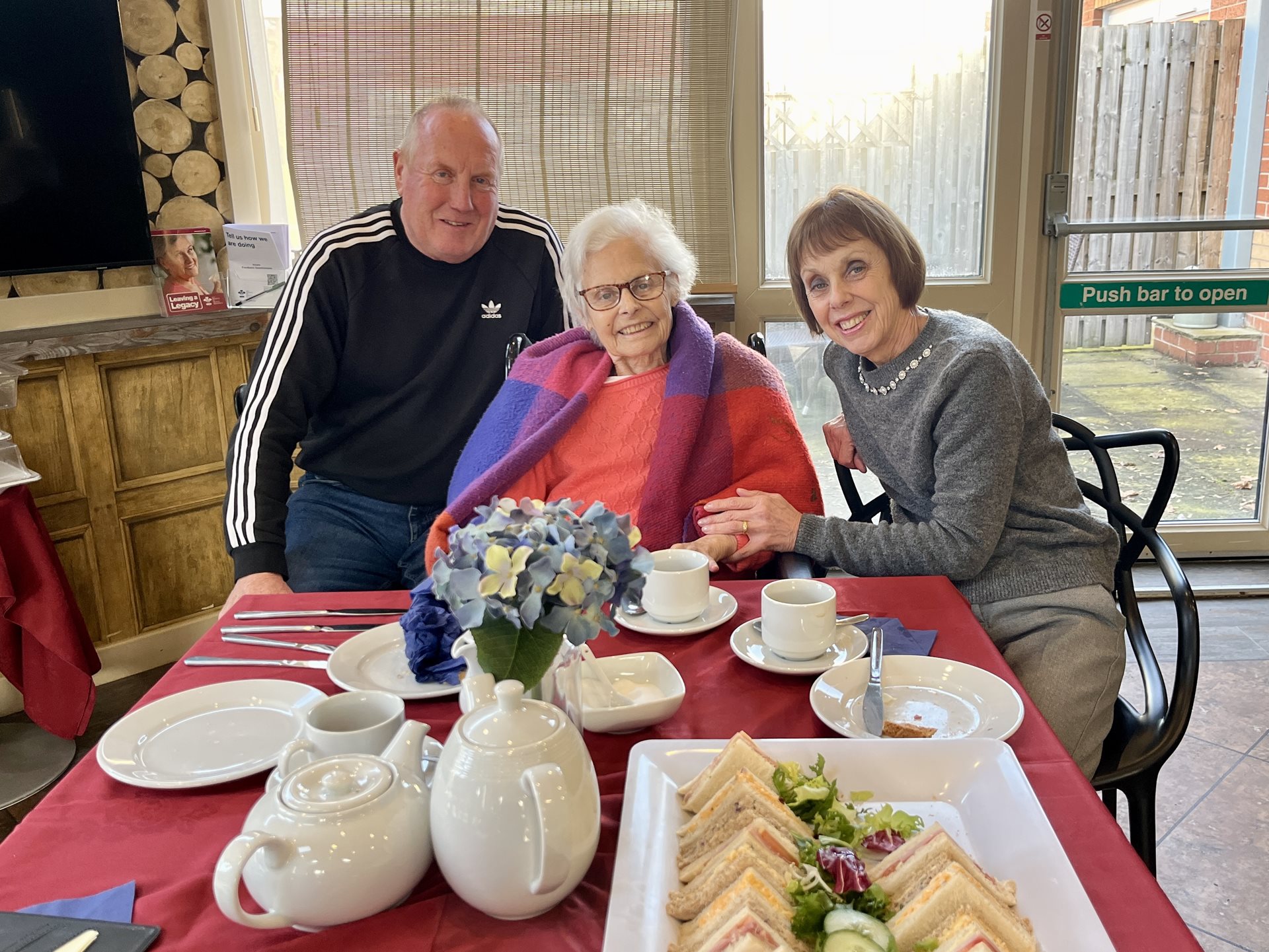 Margaret and her family enjoying afternoon tea