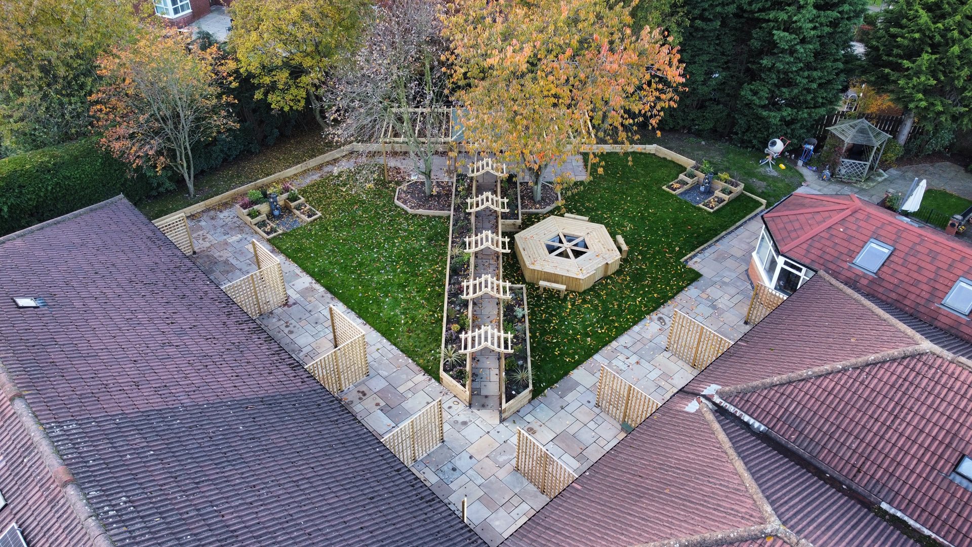 Extended patios, paths and water feature after phase 1 of the garden project